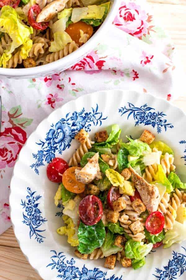 plate filled with chicken Caesar pasta salad