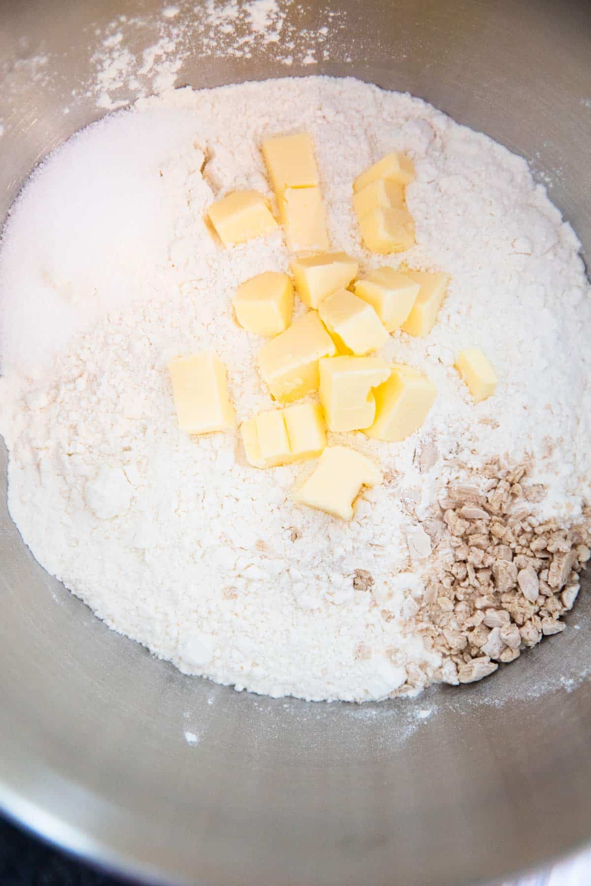 top down view of bowl with flour, yeast and butter