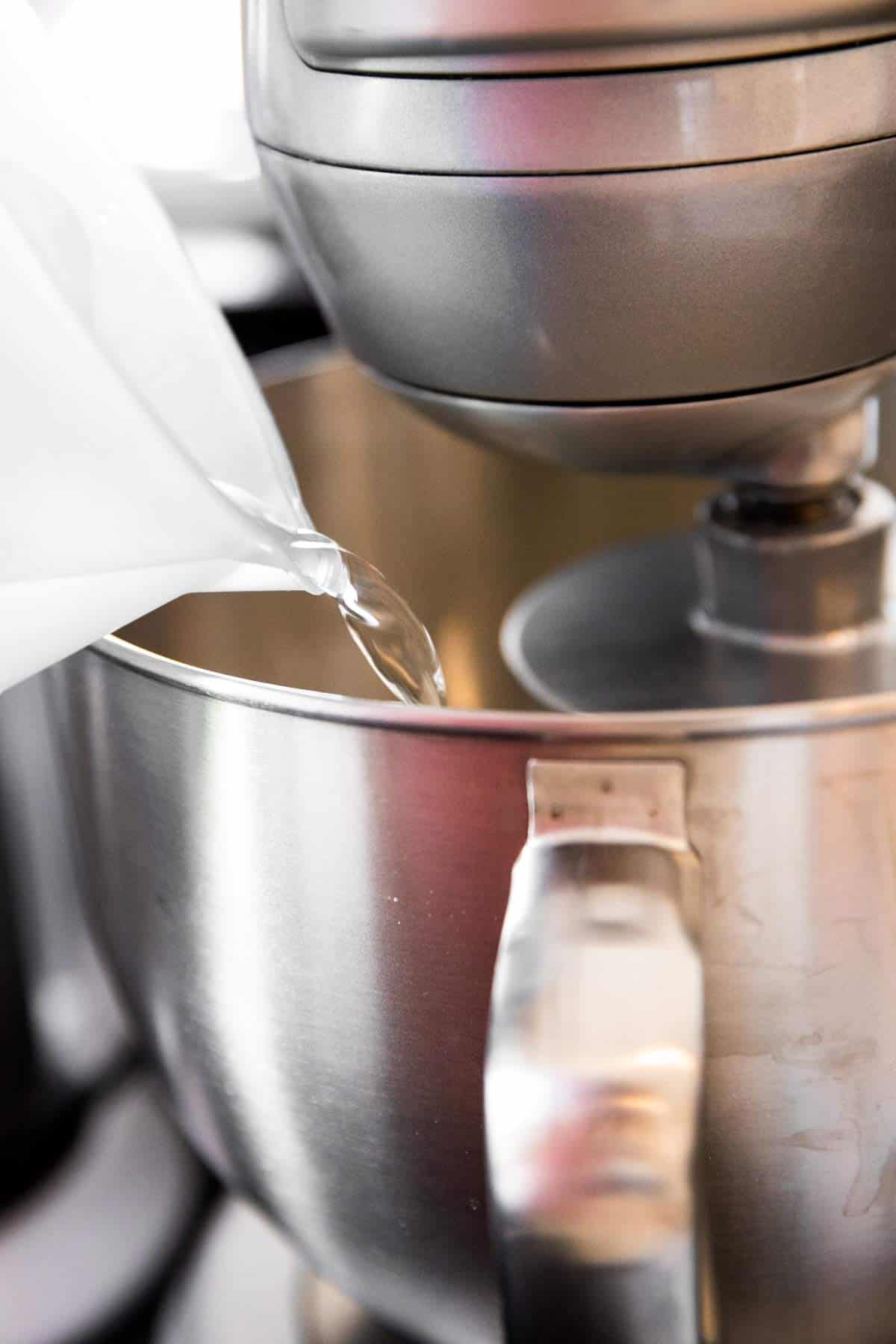 pouring water into stand mixer