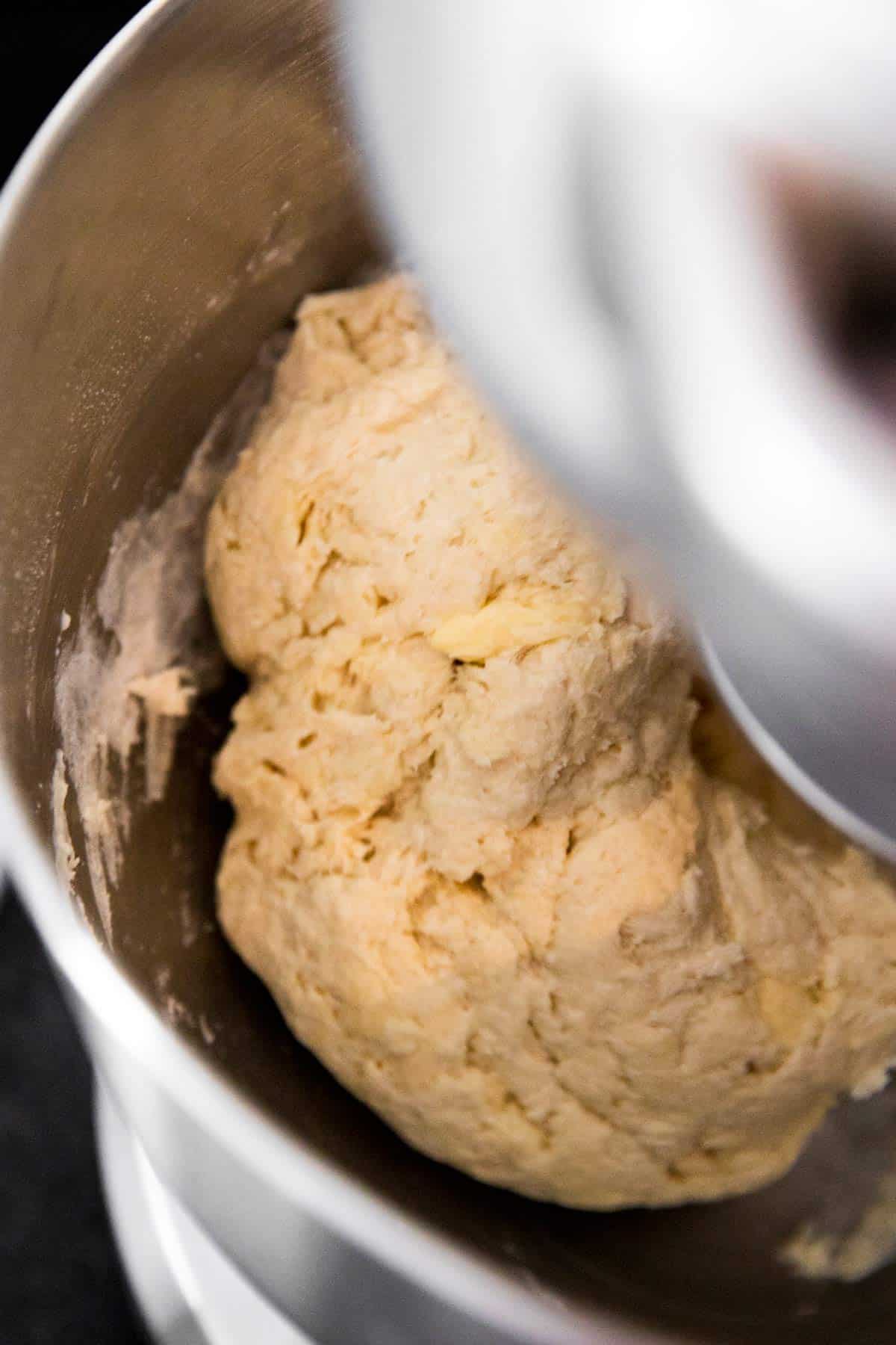 close up photo of yeast dough kneading in mixer