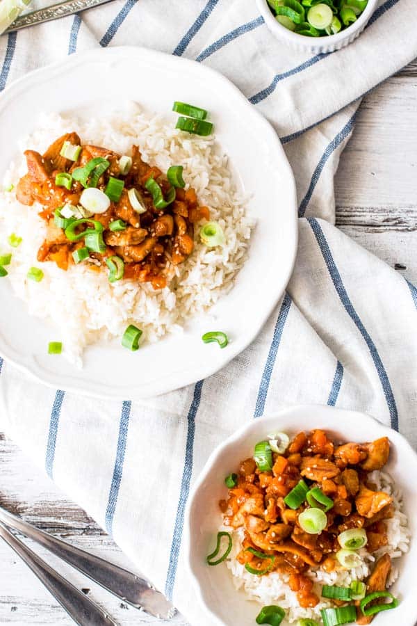 close up photo of plates with rice and apricot chicken