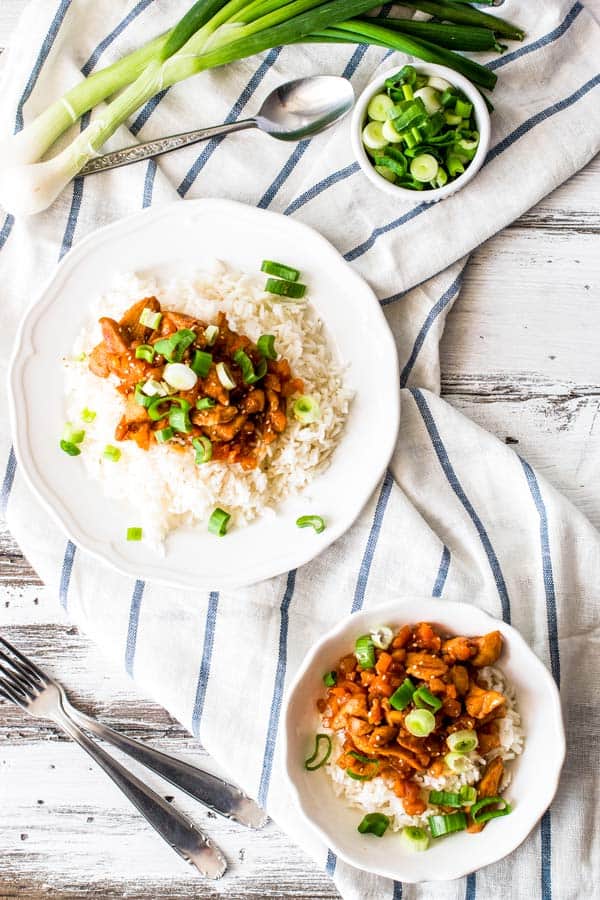 two plates with rice and apricot chicken