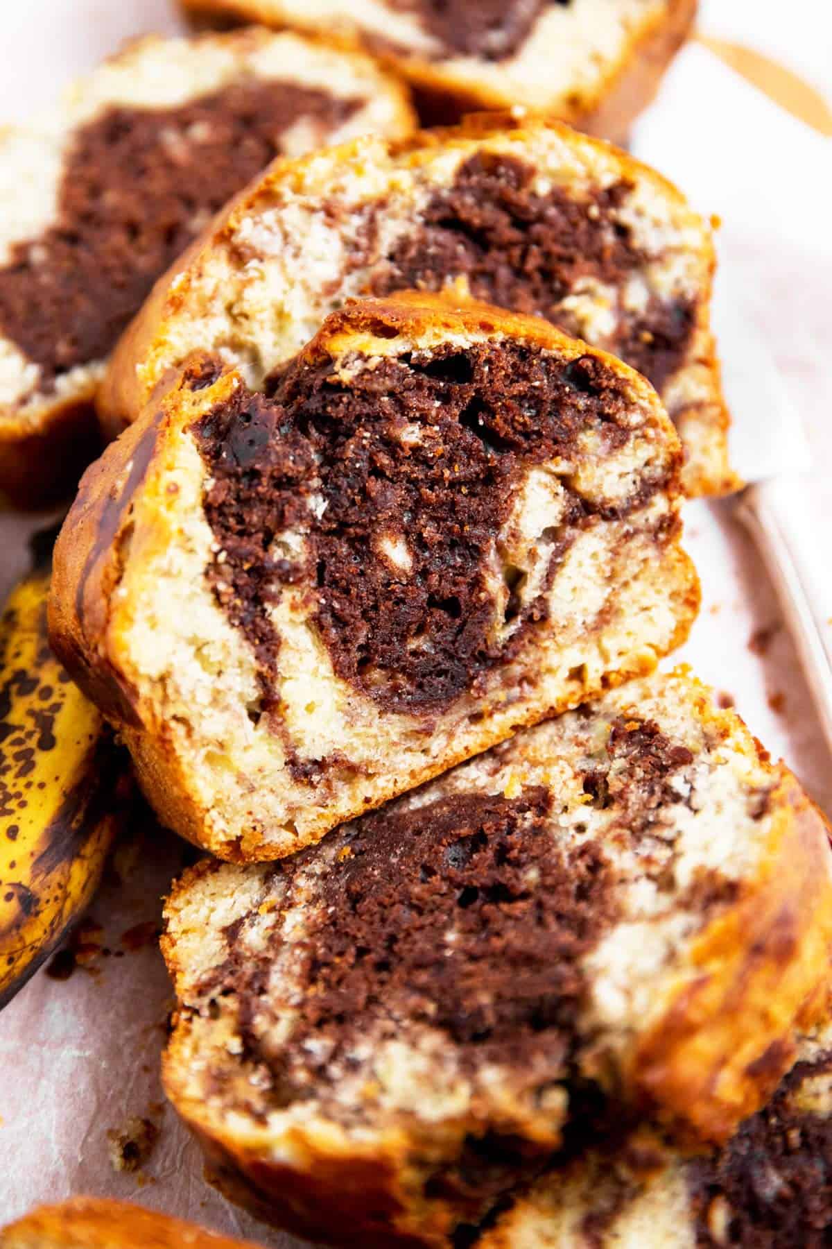 slices of chocolate marble banana bread piled up