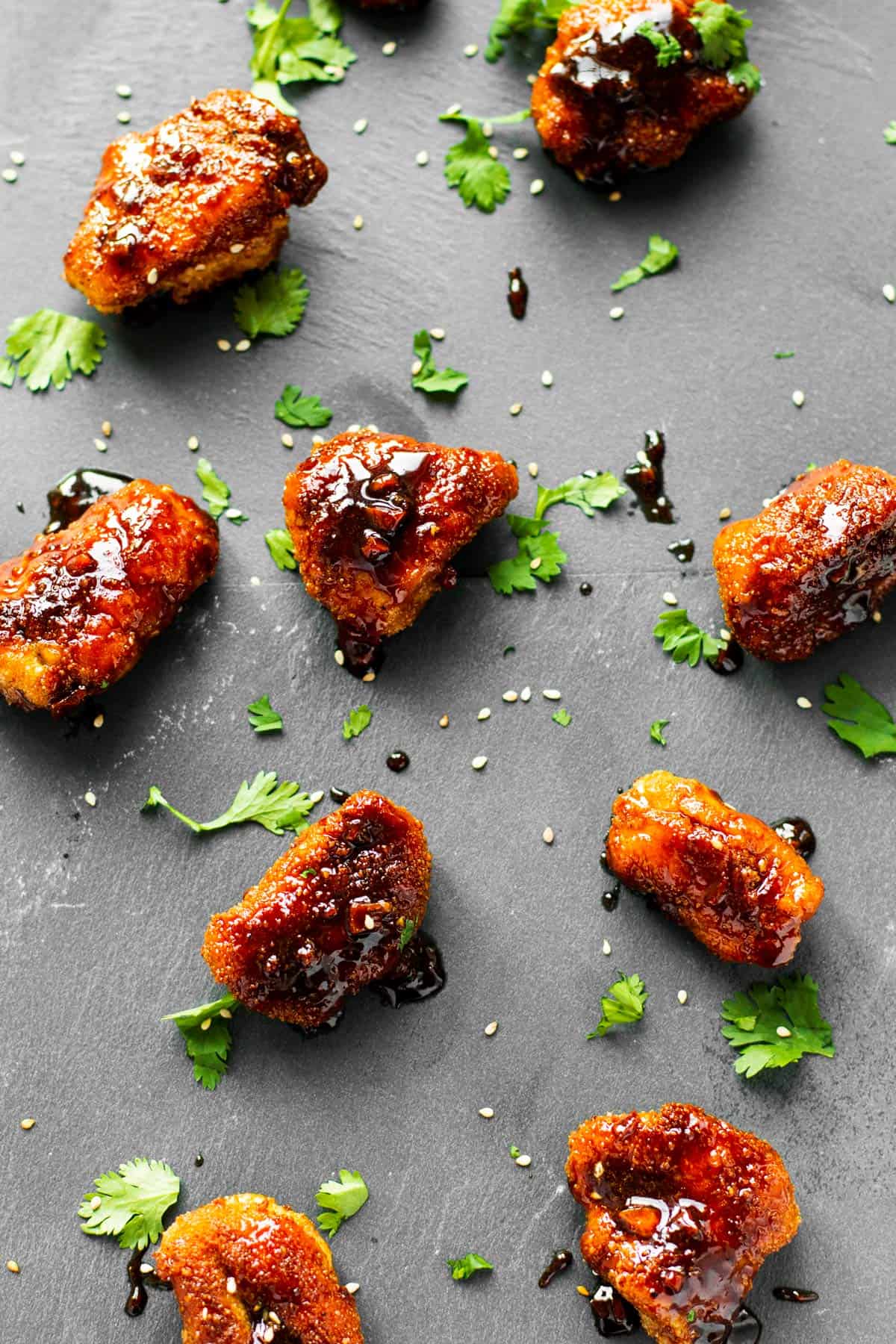 top down view on garlic chicken pieces on dark background