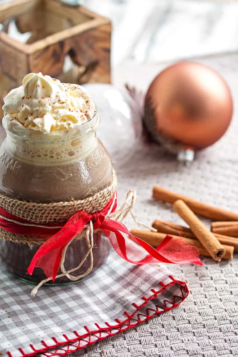 Festive tablescape with cup of hot chocolate.