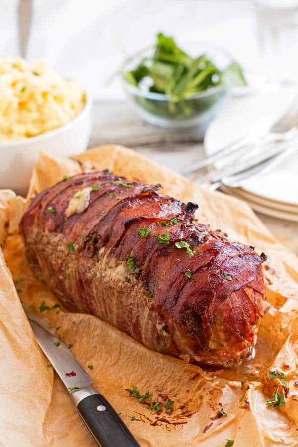 meatloaf on the table with mashed potatoes and lettuce