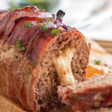 sliced cheese stuffed meatloaf with cheese oozing out