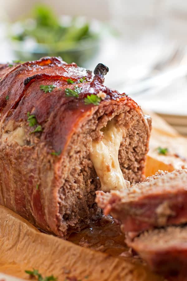 sliced cheese stuffed meatloaf with cheese oozing out