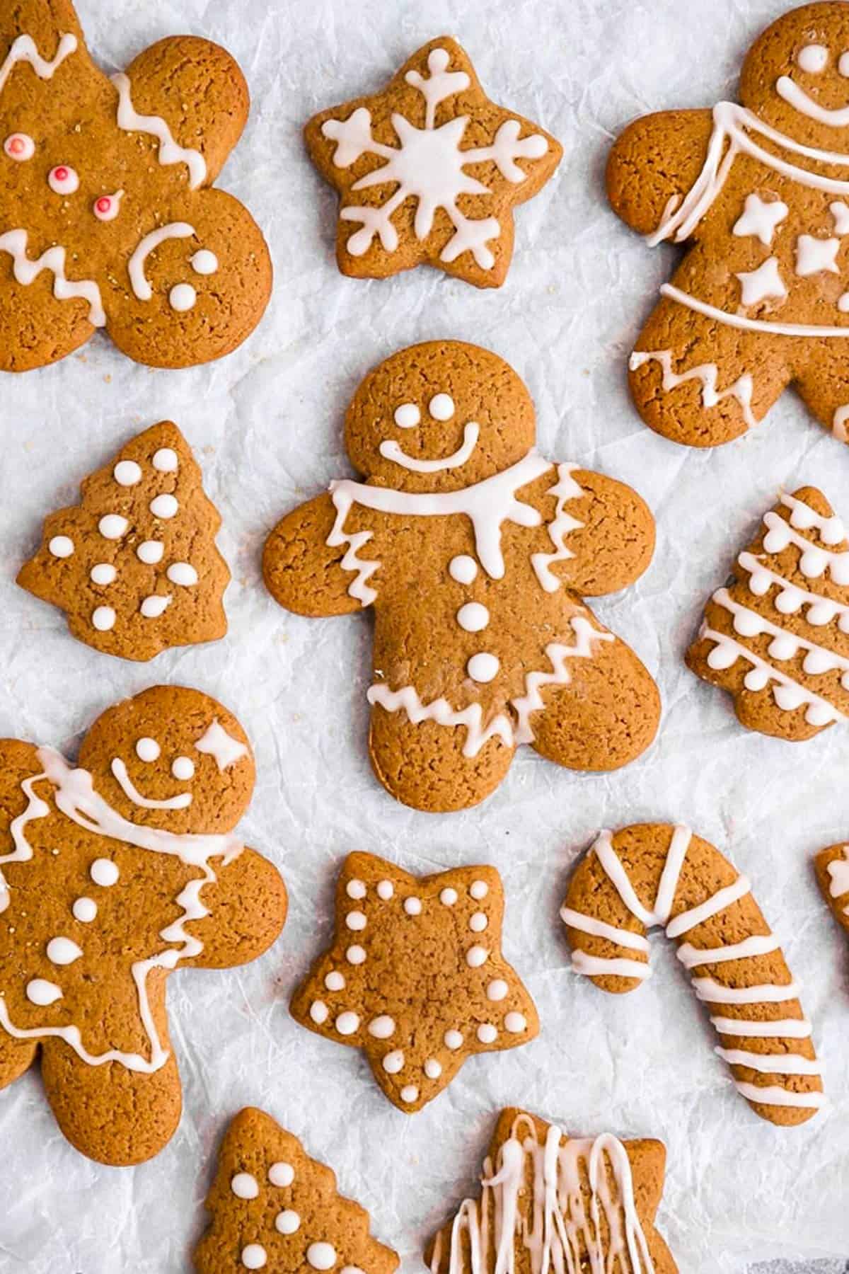 gingerbread cookies on a sheet of baking parchment