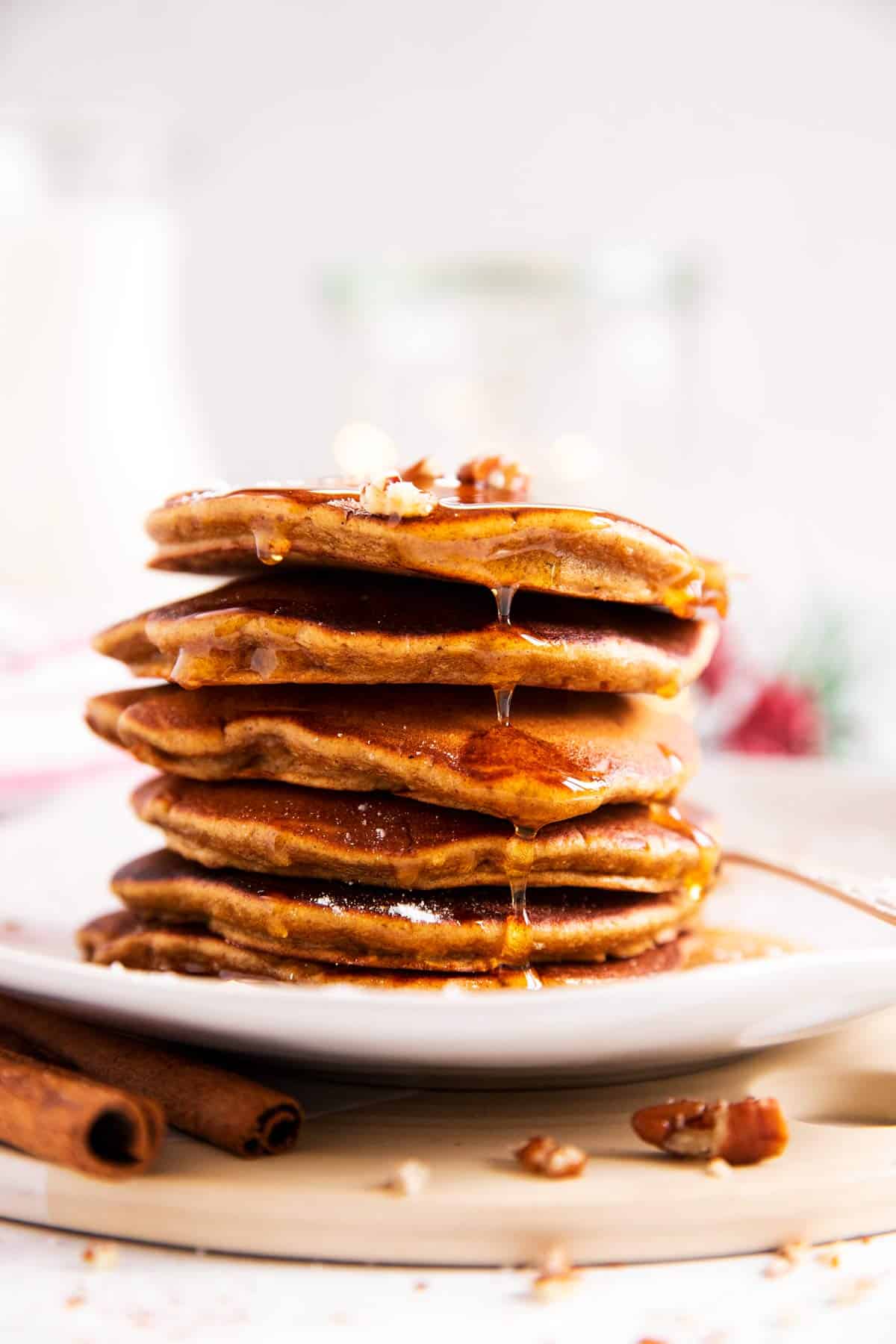 stack of gingerbread pancakes on a white plate
