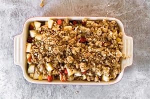 top down view on baking dish with unbaked fruit crisp