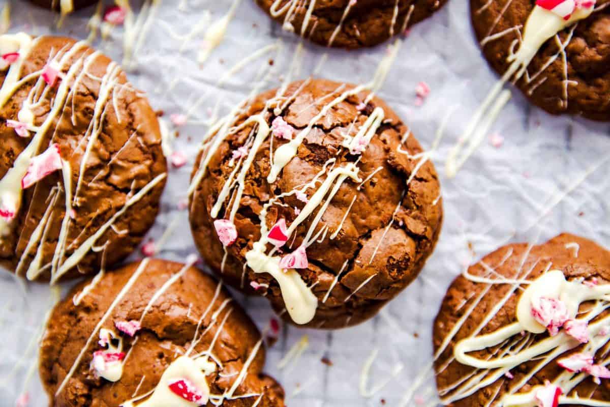 several peppermint brownie cookies on a piece of baking parchment