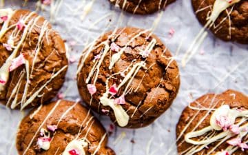 several peppermint brownie cookies on a piece of baking parchment