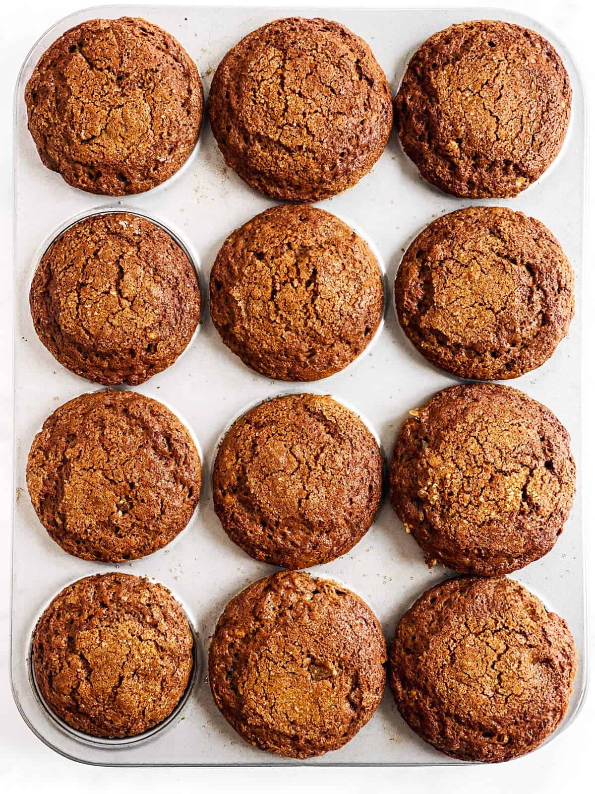 overhead view on muffin pan with gingerbread muffins