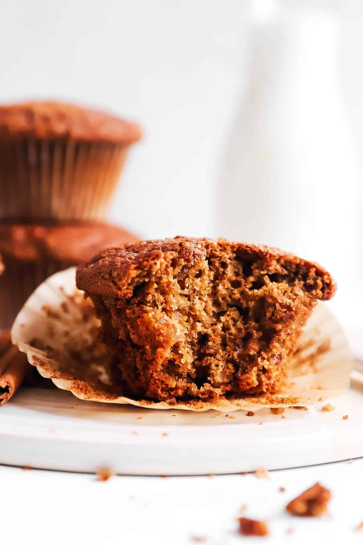 gingerbread muffin with bite taken out on white platter