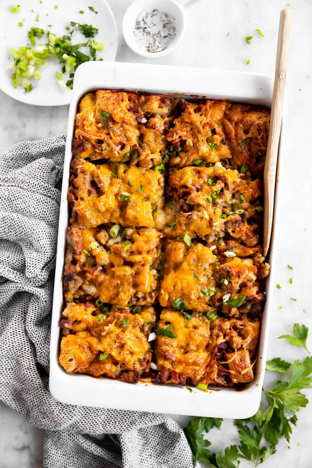 overhead view of sliced breakfast casserole in a white dish