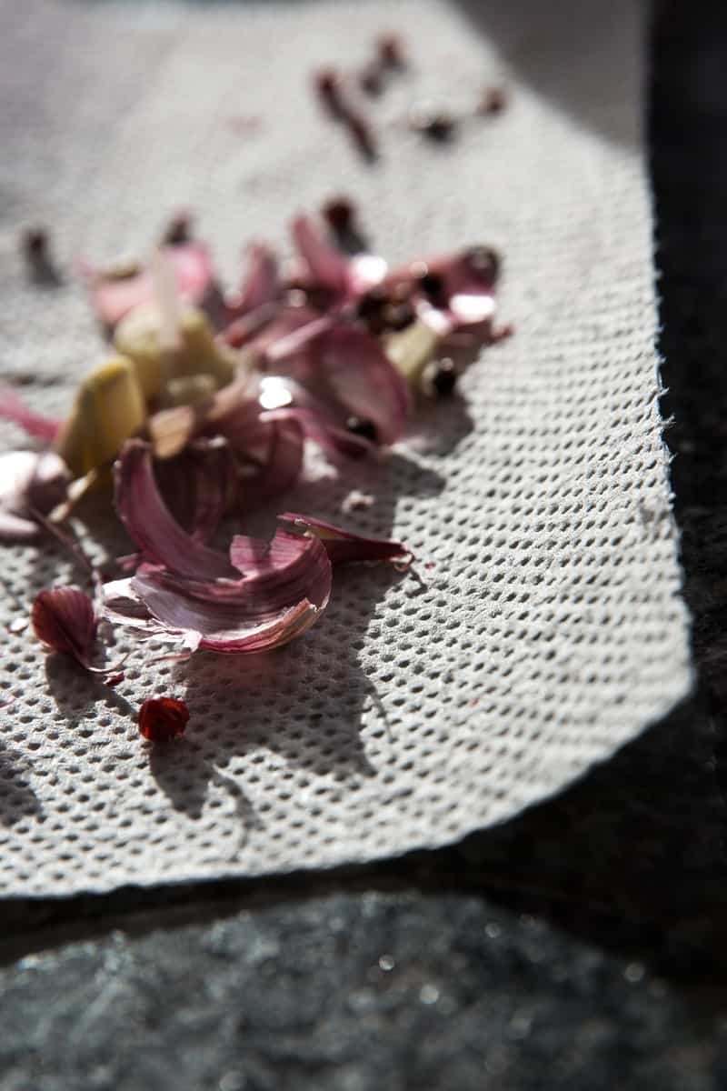 close up view of garlic peel on paper towel