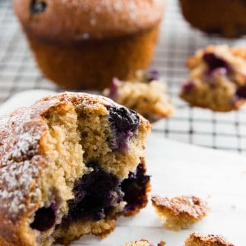 muffin sitting on a cooling rack, broken in half