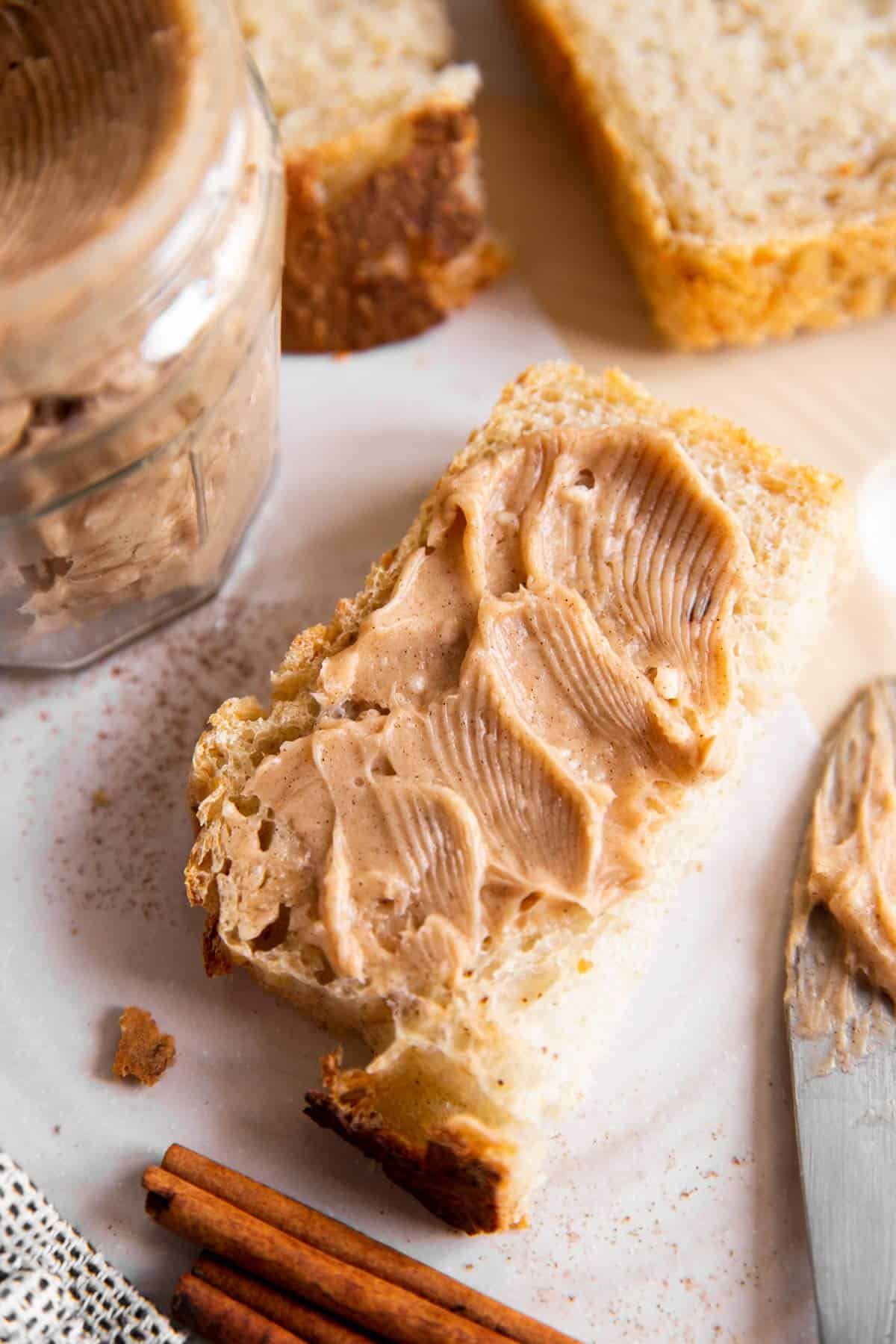 slice of bread spread with cinnamon honey butter 