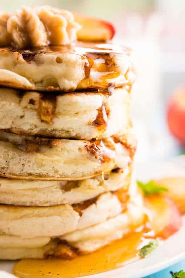 close up photo of stack of peach pancakes