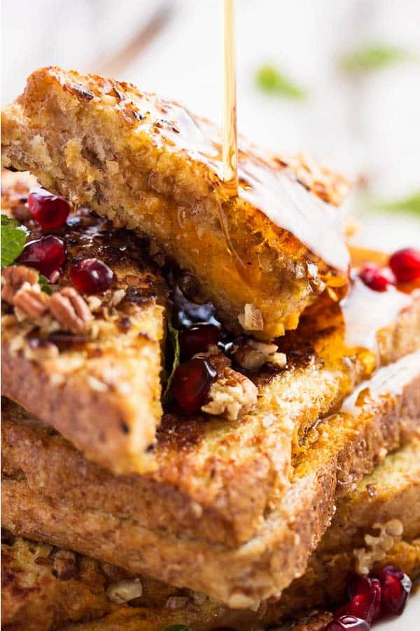 stack of pumpkin French toast drizzled with maple syrup