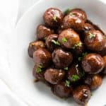 top down view on cranberry turkey meatballs in white bowl