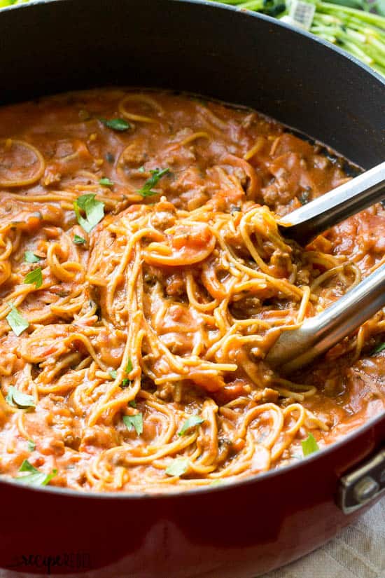 one pot spaghetti and meat sauce in red skillet