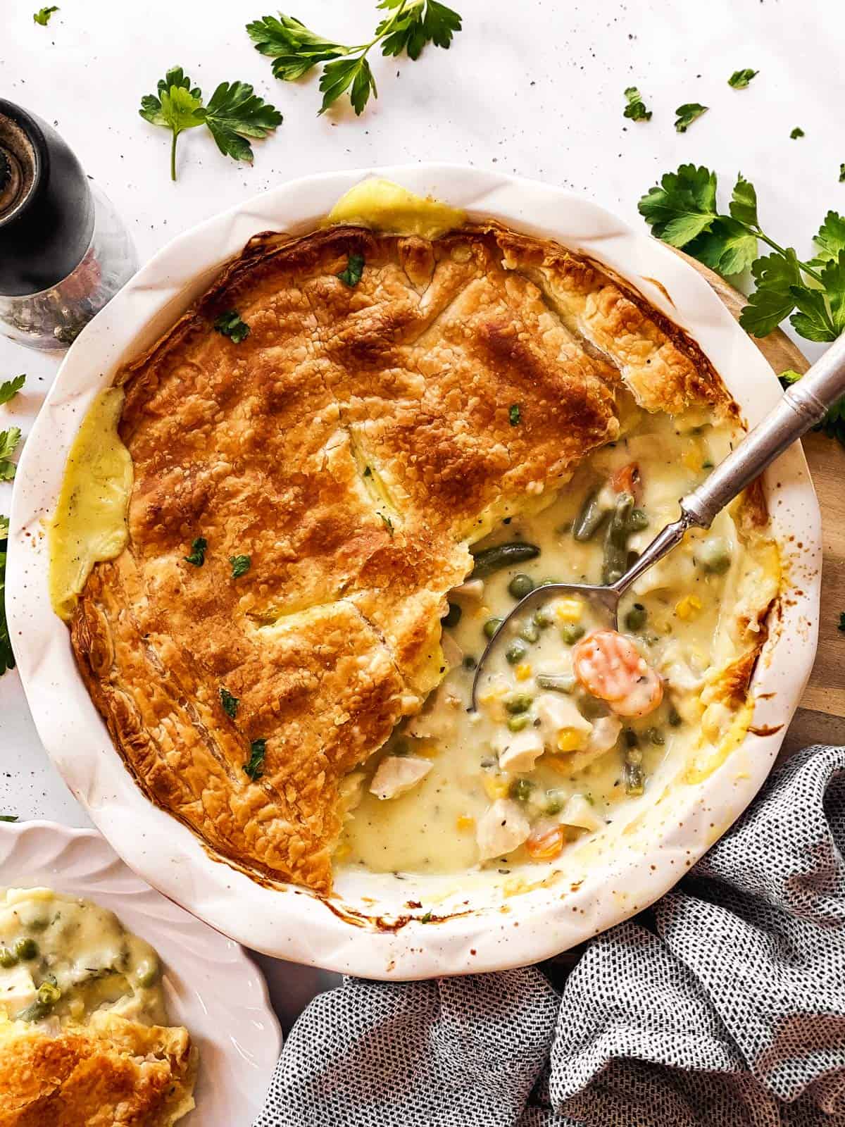 overhead view of turkey pot pie with serving spoon