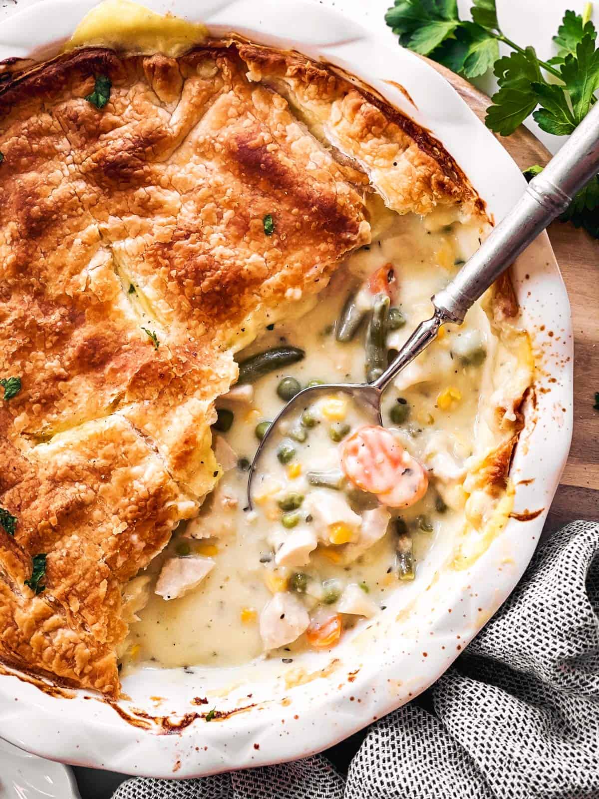 close up photo of spoon in turkey pot pie