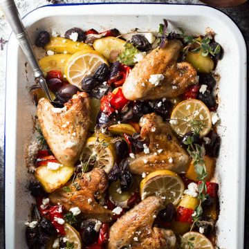 top down view on white enamel pan filled with greek chicken