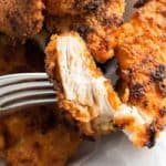 Crispy oven fried chicken on a fork.