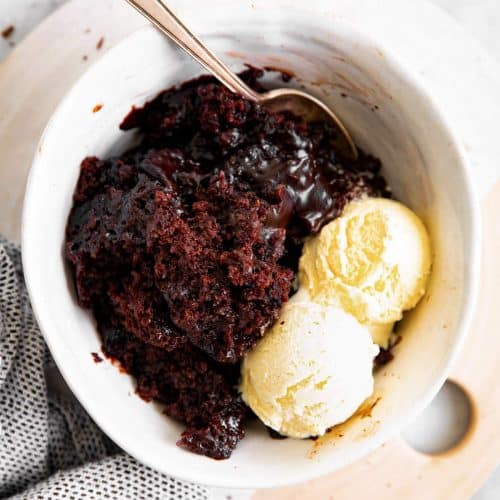 white bowl with chocolate pudding cake and ice cream