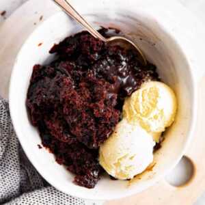 white bowl with chocolate pudding cake and ice cream