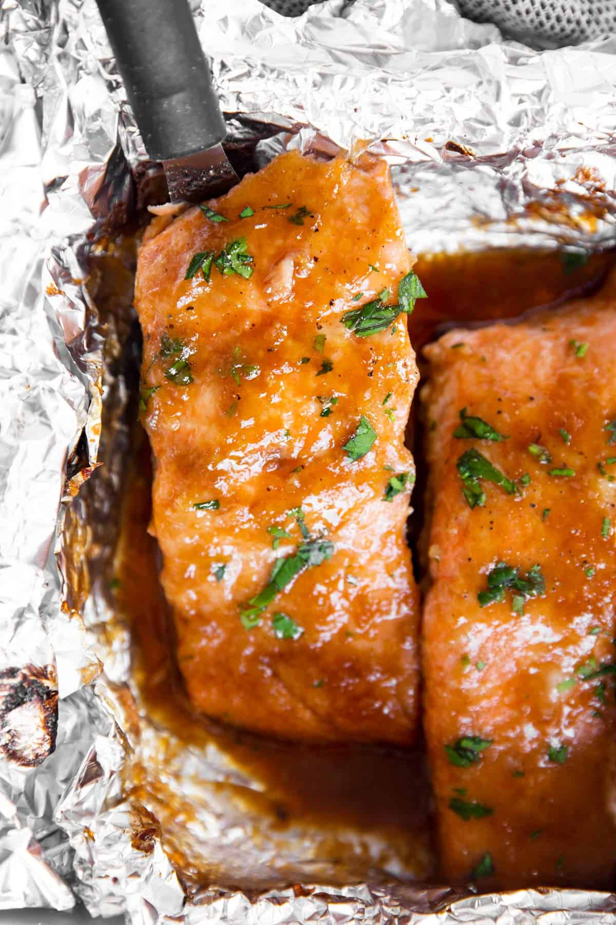 close up photo of honey garlic salmon in foil