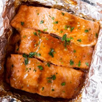 three salmon fillets in foil with honey garlic glaze