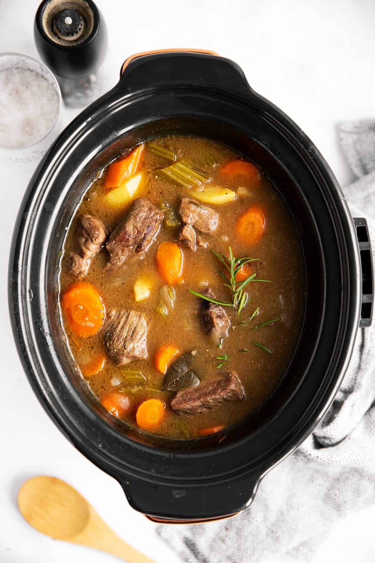 top down view of a slow cooker with beef stew inside