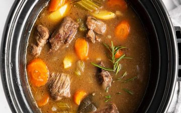 close up photo of crock with Irish beef stew inside
