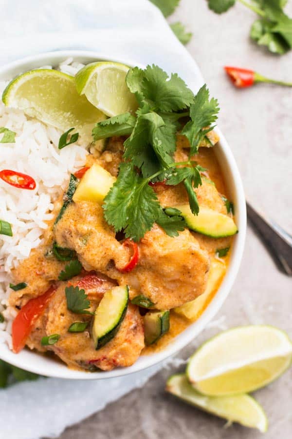 top down view on shrimp curry and rice in white bowl