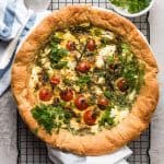 top down view on tomato spinach feta quiche on cooling rack