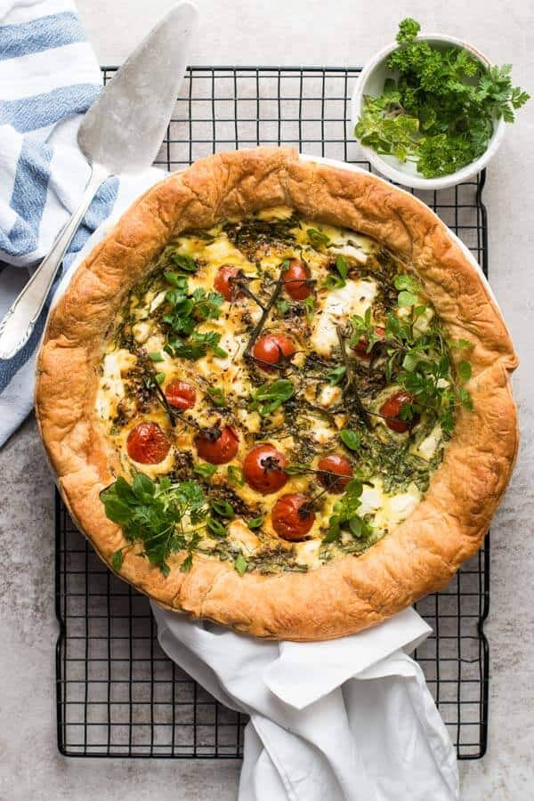 top down view on tomato spinach feta quiche on cooling rack