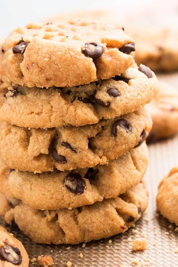 stack of peanut butter cookies on a silicone baking mat