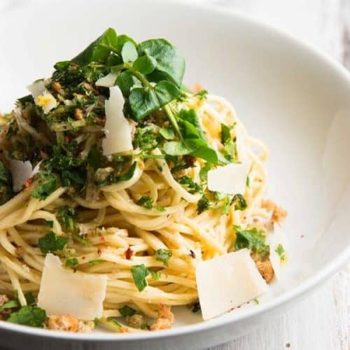 This Garlic Butter White Wine Pasta with Fresh Herbs recipe is amazing! With an easy, creamy sauce that's full of parmesan cheese and lemon flavors, you can even serve it to picky guests!