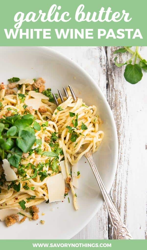 garlic butter pasta on white plate with text overlay