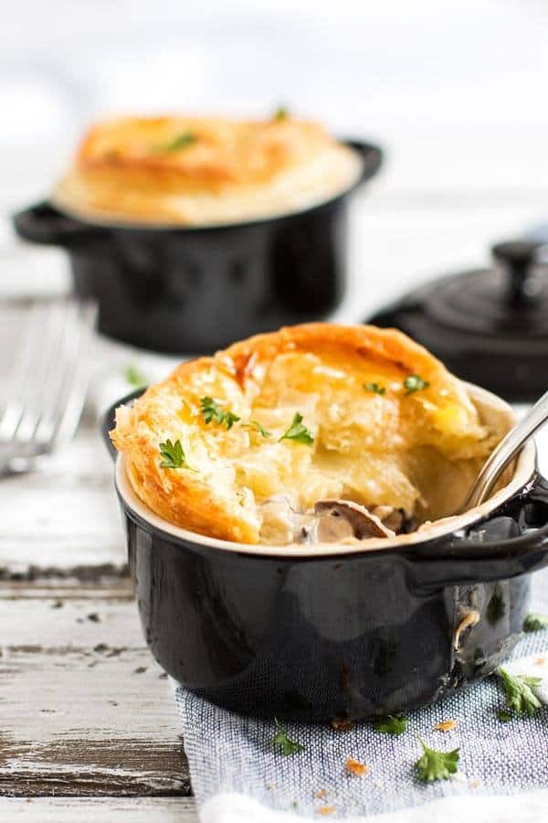 frontal view on chicken pot pie with a spoon inside