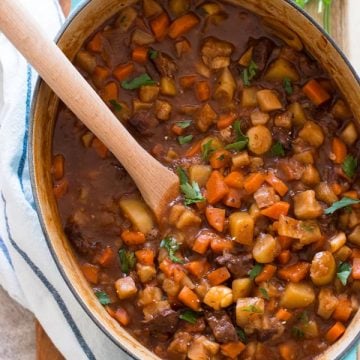 oval dutch oven filled with a classic beef stew