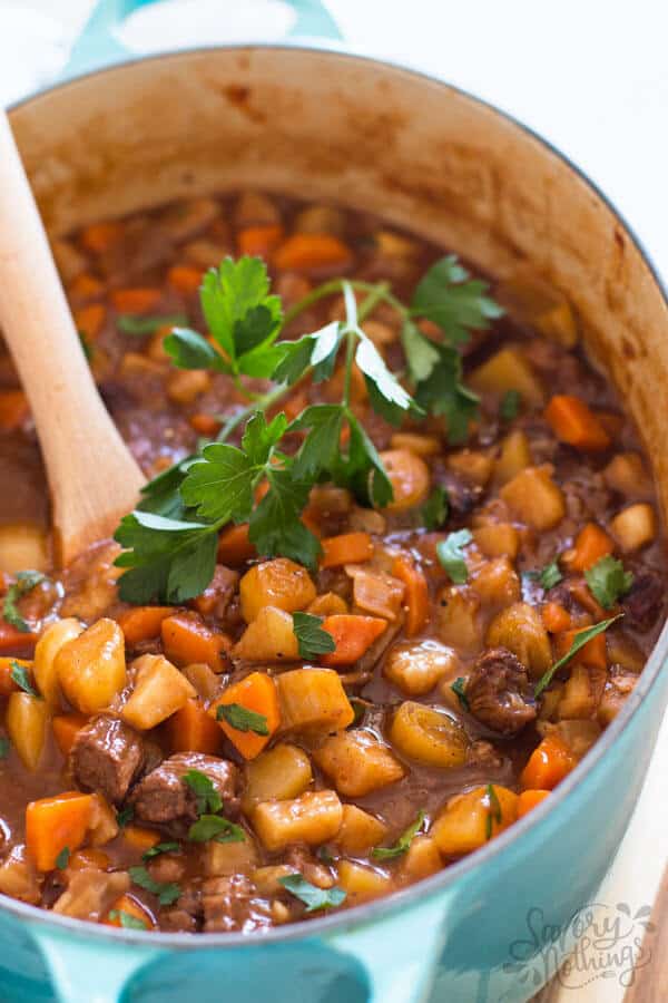 close up photo of classic beef stew in a Dutch oven