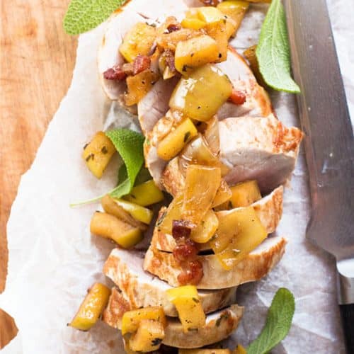 sliced pork loin with apples on parchment