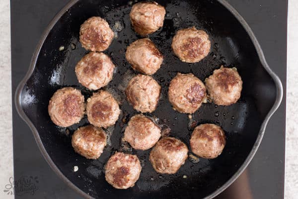 top down view on cooked meatballs in skillet