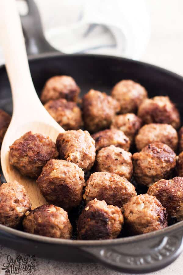 close up photos of meatballs in cast iron skillet