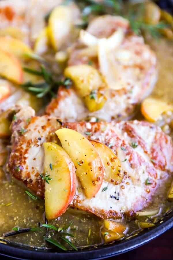 close up photo of pork chops with apples and onions